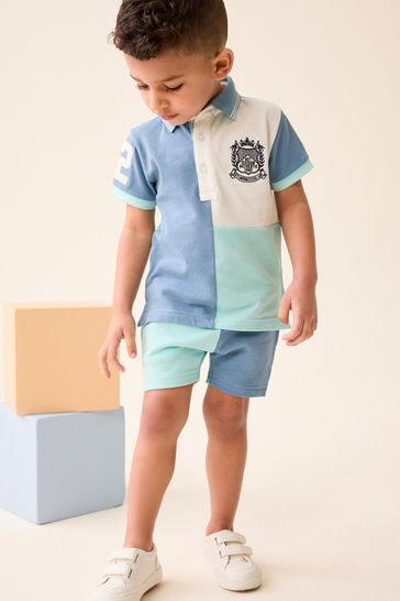 Conjunto de polo de manga corta y pantalón corto en color azul y blanco (3 meses - 7 años)