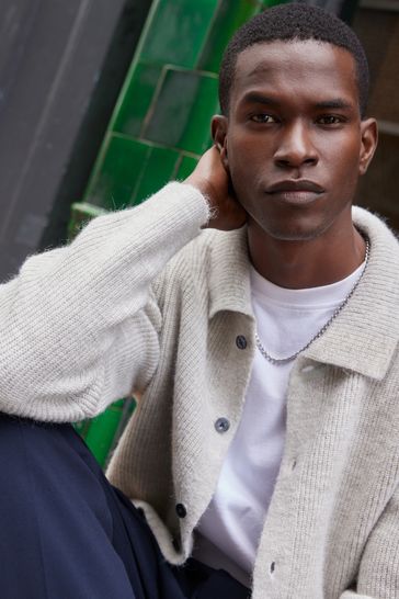 Fully top buttoned polo