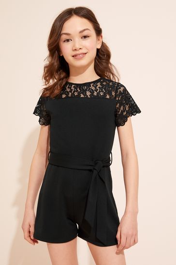 Buy Lipsy Black Lace Yoke Belted Playsuit from Next Luxembourg