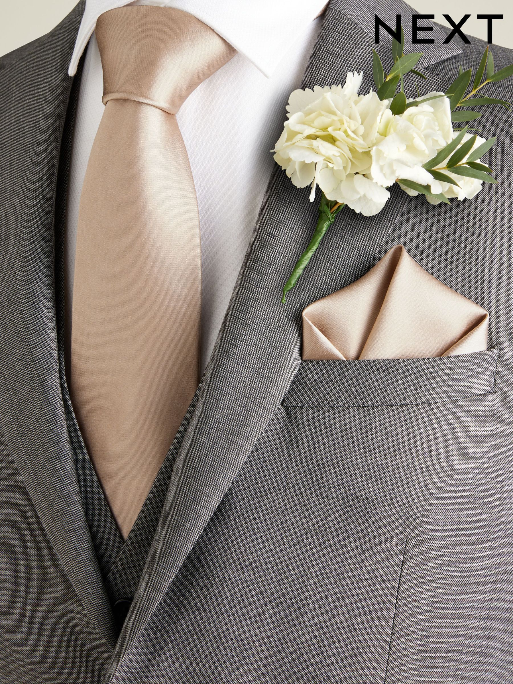 grey suit with champagne tie