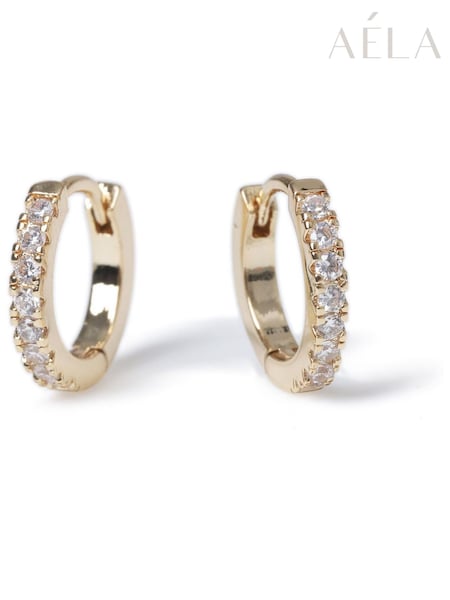 Aela Gold Tone Diamond Simulants Huggie Hoops (154041) | €26