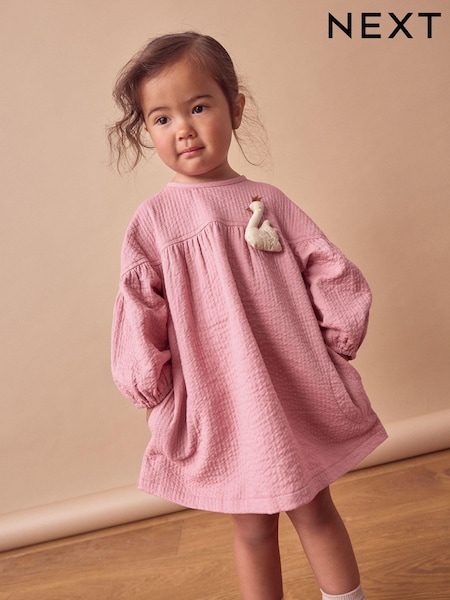 Pink Swan Character Textured Dress (3mths-8yrs) (666596) | AED49 - AED60