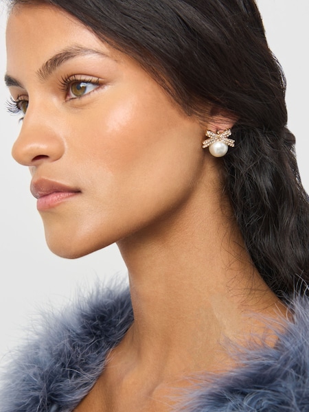 Aela Gold Tone  Pearl Bow Stud Earrings (AL7141) | ₪50