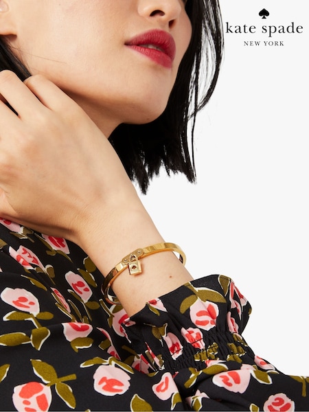 kate spade new york Gold Tone Charm Bangle (AT8985) | €53