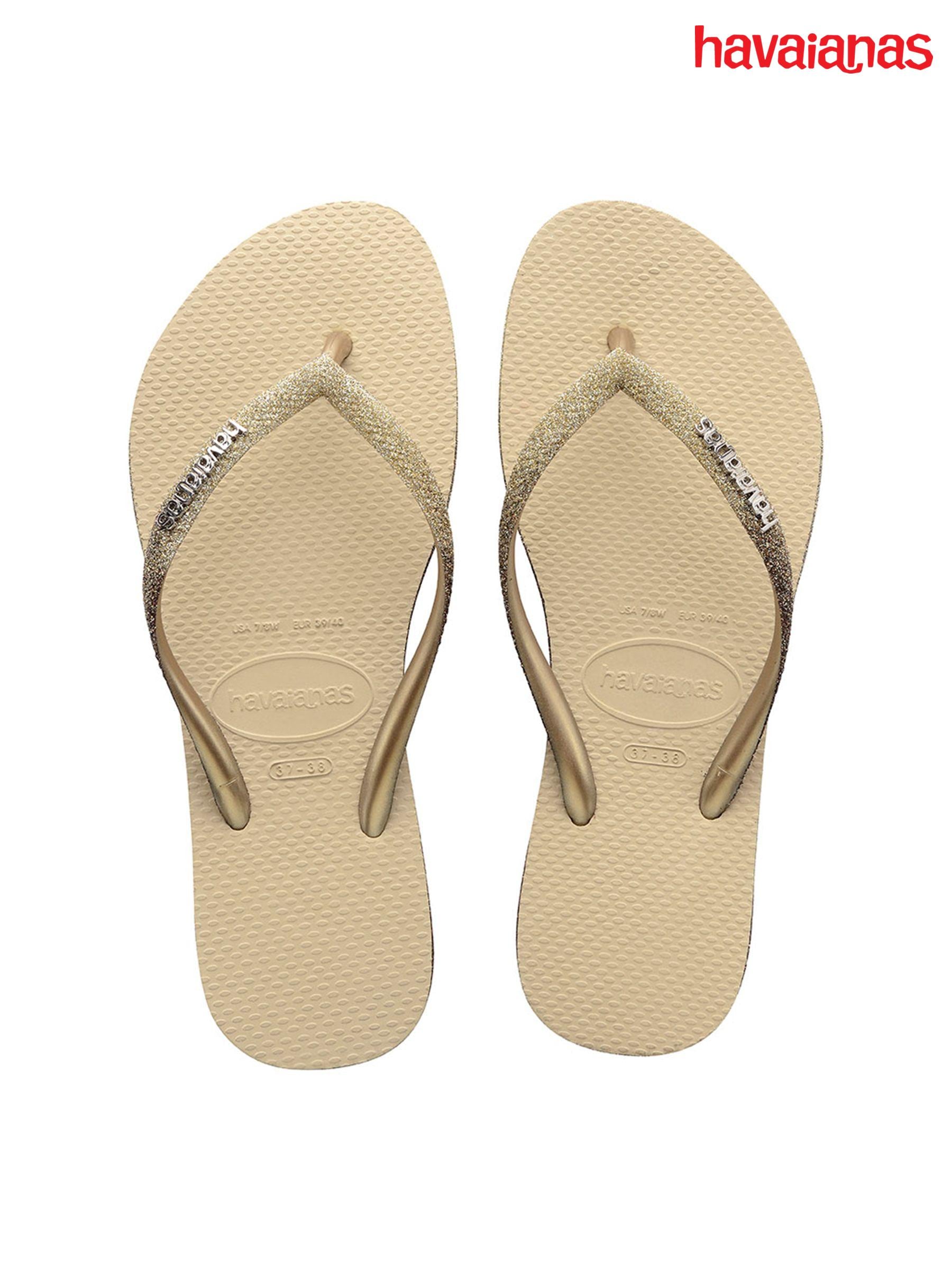 Gold sparkly flip flops top