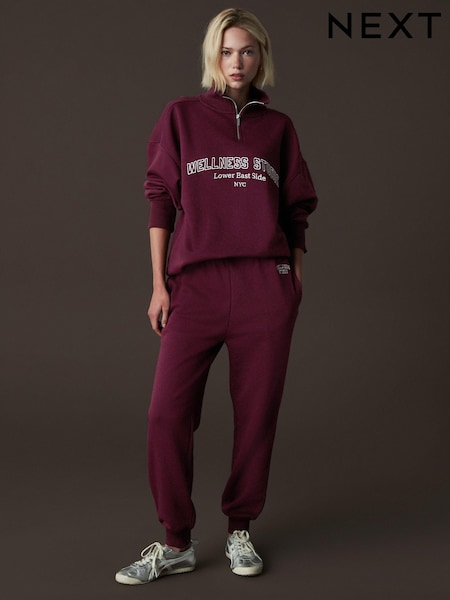 Burgundy Red Relaxed Fit Cuffed Wellness Slogan Graphic Track Joggers (E56285) | AED58