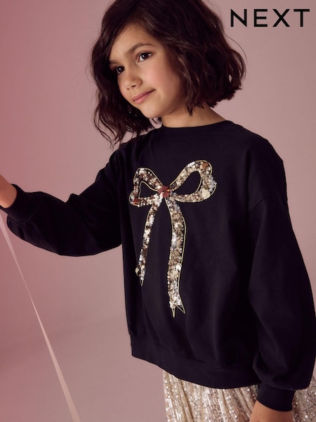 Schwarz/Gold - Sequin Bow Long Sleeve Wrap Back 100% Cotton Top (3-16yrs) (N90194) | 13 € - 18 €