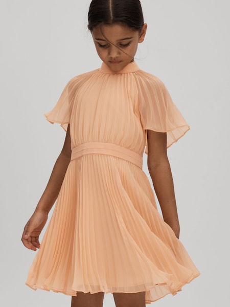 Junior Pleated Cape Sleeve Dress in Apricot (N21579) | £75