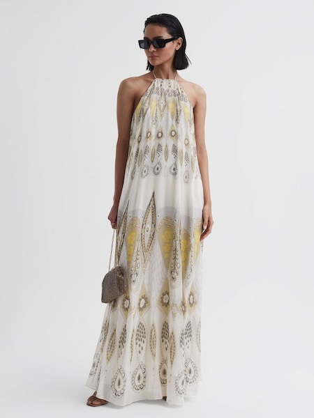 Lange jurk met print en halterhals in geel (D85819) | € 270