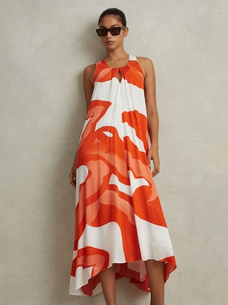Oranje/witte midi-jurk met print en ongelijke zoom (N74307) | € 345