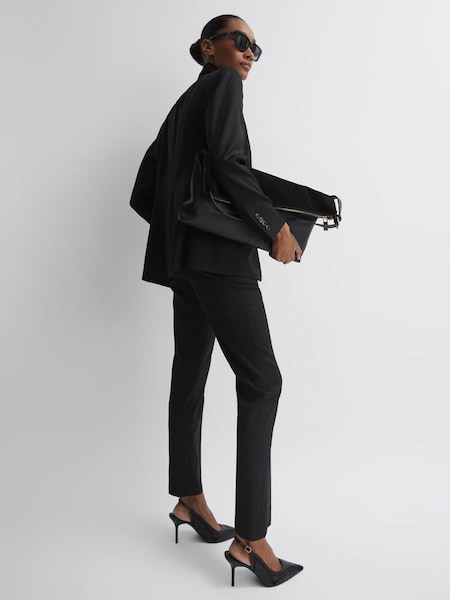 Pantalon de costume fuselé en laine mélangée noir (T42872) | 195 €
