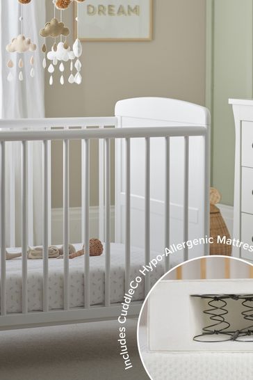 white cot bed with mattress