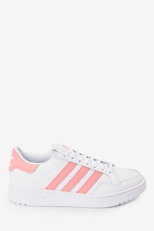 white adidas trainers with pink stripes