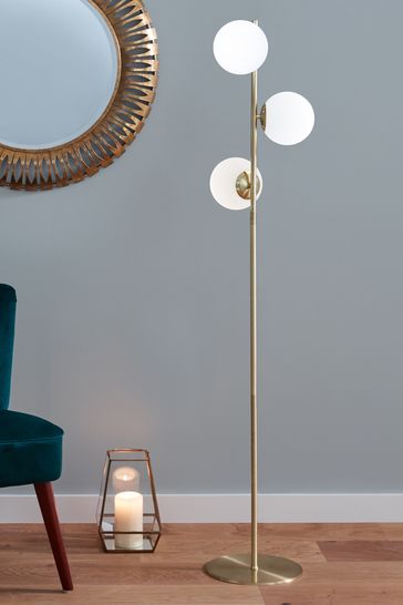 gold floor lamp next