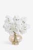 White Artificial Blossom in Gold Vase