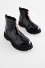 Schwarzes Lackleder - Stiefel mit dicker Sohle und Reißverschluss vorne