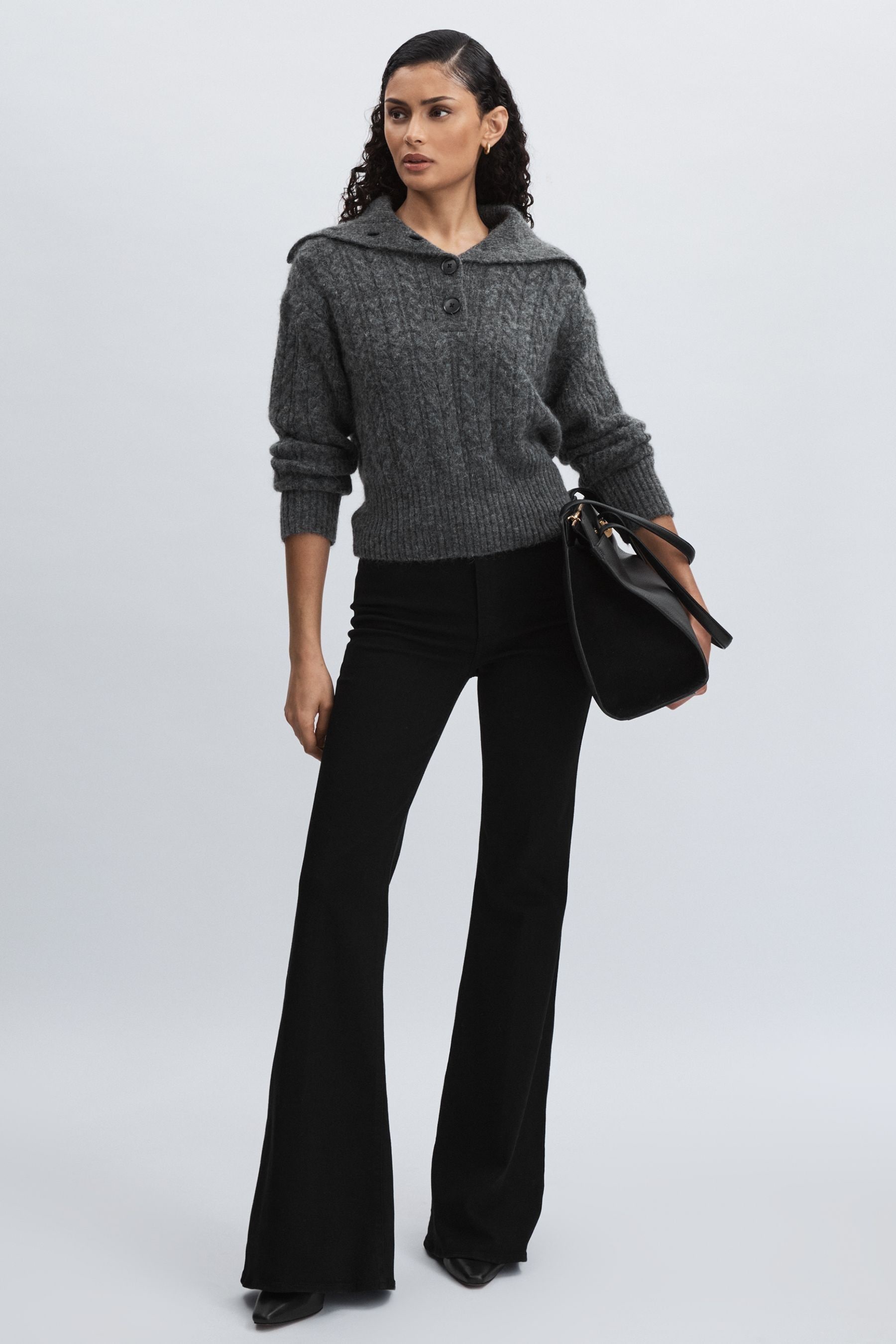Paige Angled Waist Flared Jeans In Black