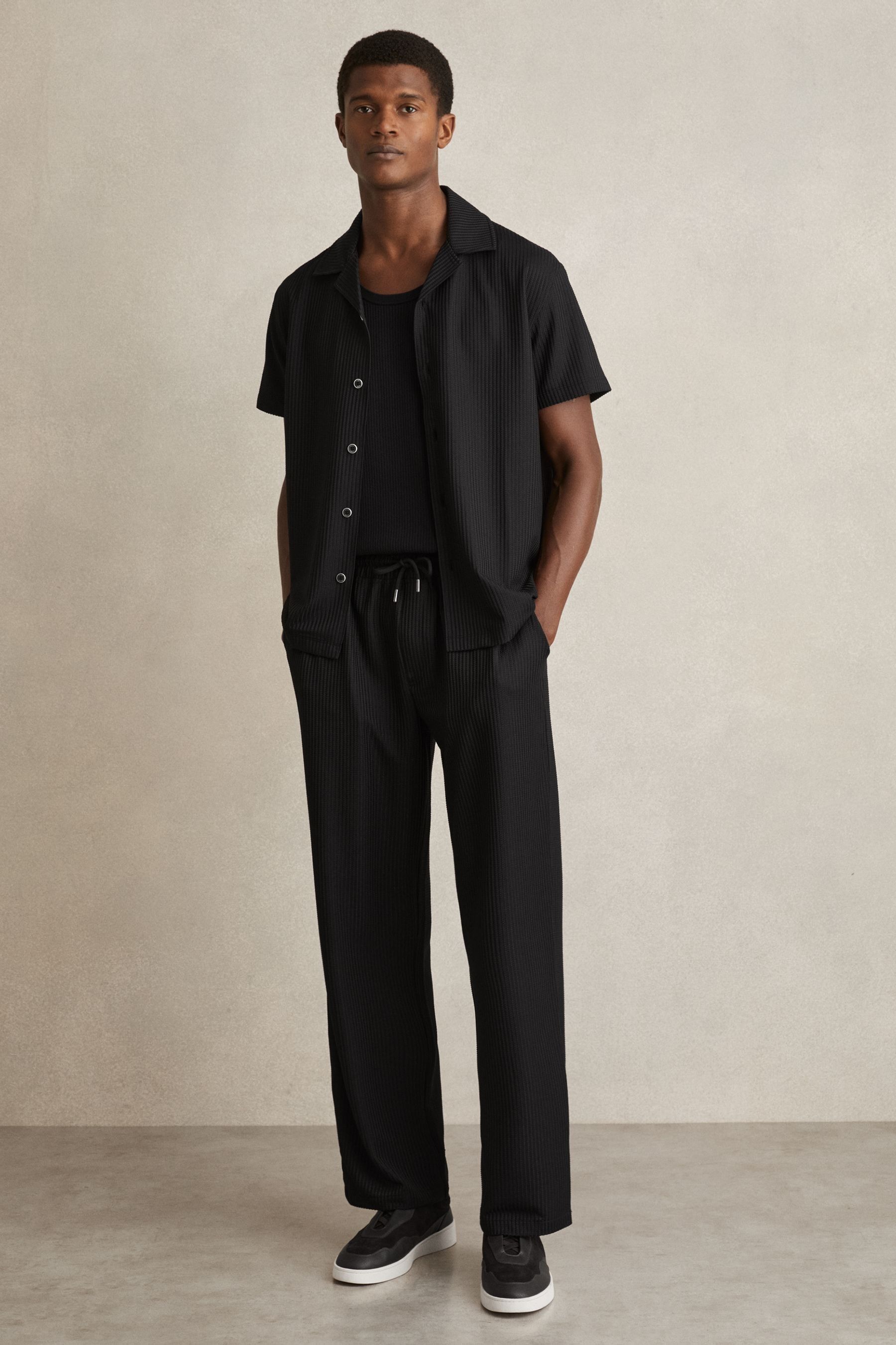 Reiss Black Textured-knit Tapered Trousers