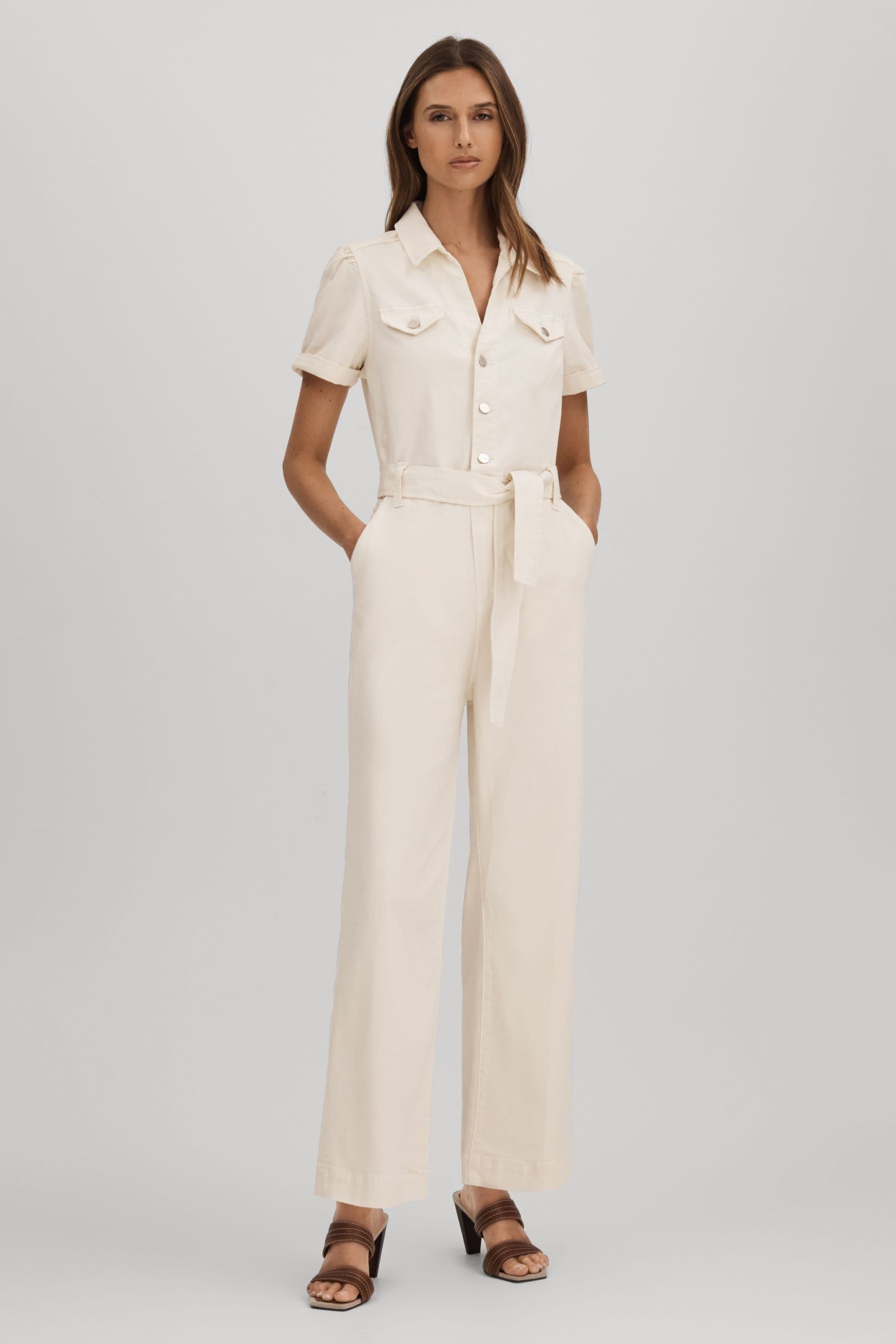 Paige Denim Puff Sleeve Jumpsuit In White