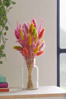 Pink and Yellow Artificial Flowers In Glass Bottle