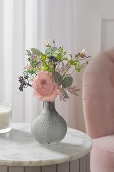 Pink Artificial Flowers In Glass Bottle