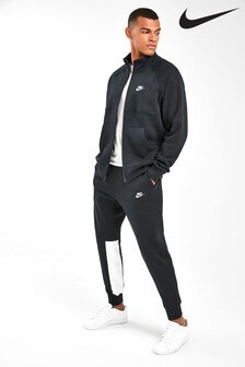 blue nike tracksuit with white stripe