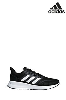 white and black adidas trainers