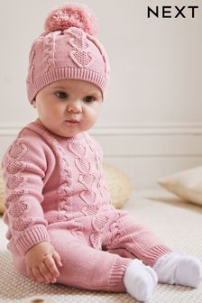 Pink Cable Knitted Baby Romper And Hat (0mths-2yrs) (T84098) | £22 - £24