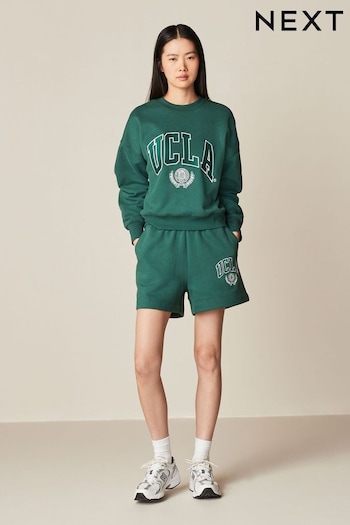 Green Licence UCLA Collegiate University Graphic Varsity Slogan Sweat Shorts (124401) | £26