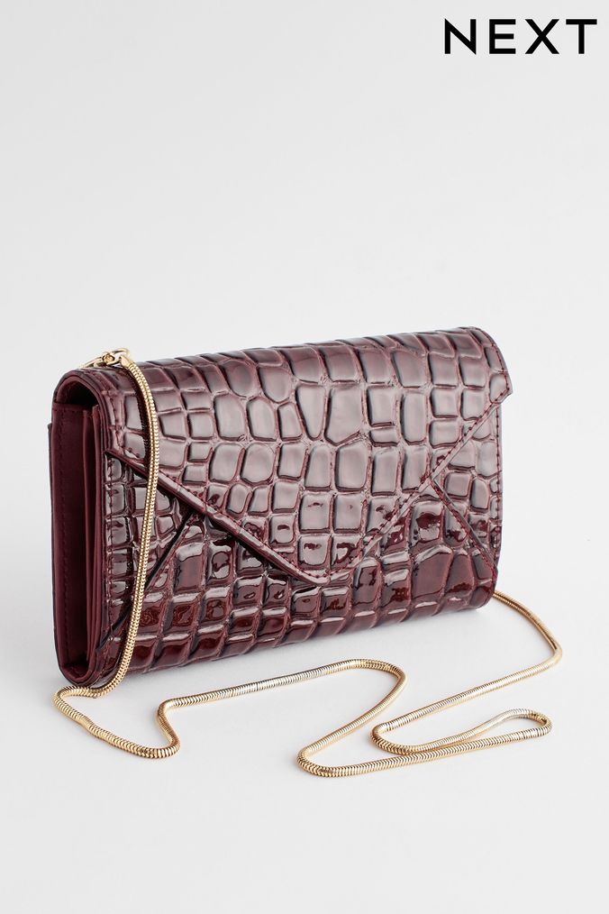 Red clutch shop bag next