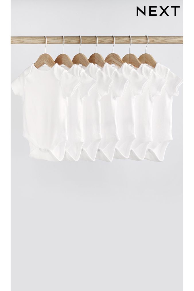 White Essential White 7 Pack Essential Baby Short Sleeve Bodysuits (615805) | £12.50 - £14.50