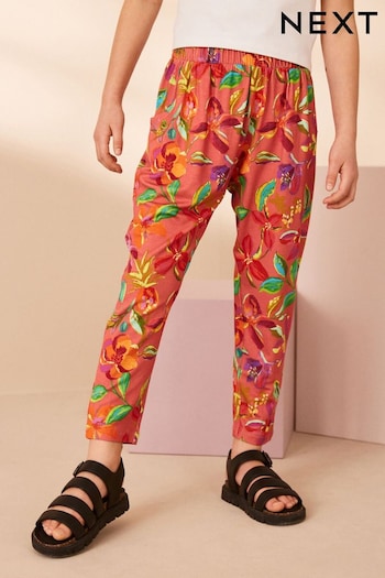 Rust Orange/ Pink Tropical Flower Print Jersey Stretch Lightweight fitted Trousers (3-16yrs) (641075) | £10 - £15