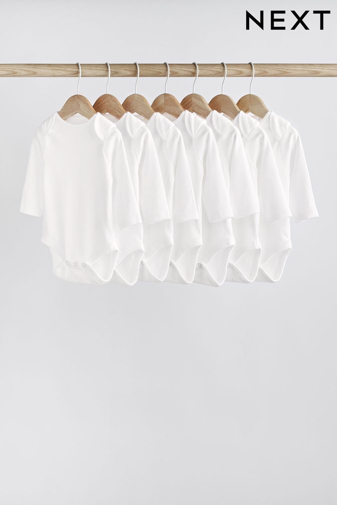 White White 7 Pack Essential Baby Long Sleeve Bodysuits (645262) | £14 - £16