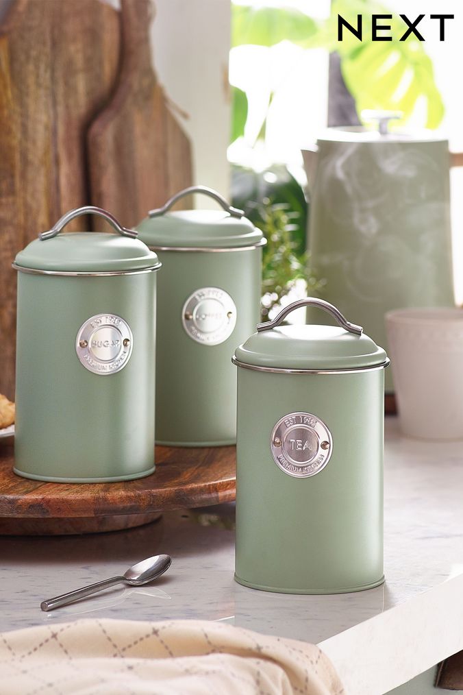 Silver tea coffee sugar shop canisters next