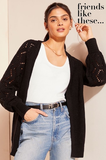 Wrap yourself in warmth without compromising style with our longline Black Stitch Sleeve Crochet Cardigan (K80405) | £38