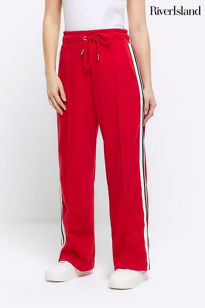 Red joggers on sale with white stripe