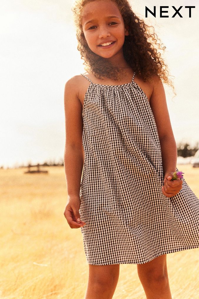 Girls black and white checkered dress top