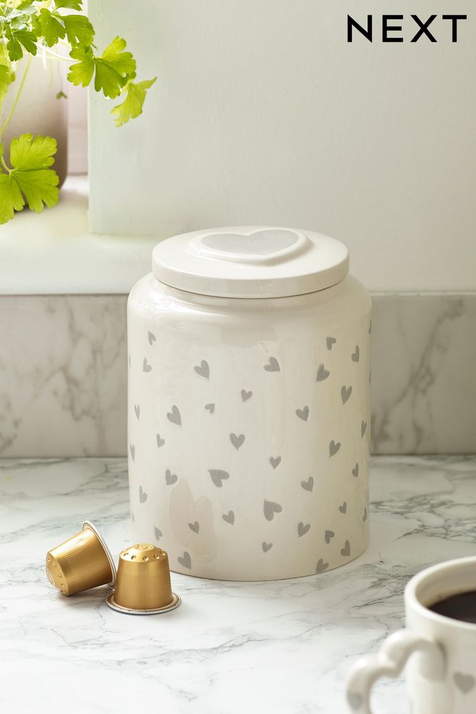 Silver tea coffee sugar shop canisters next