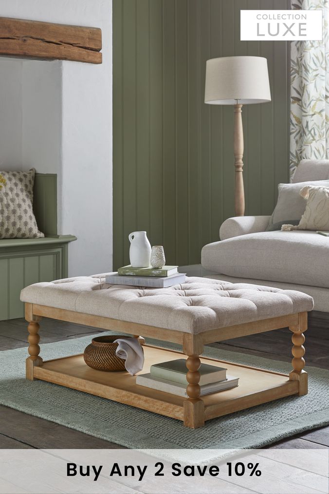 Upholstered coffee deals table with shelf