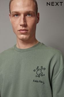 تصميم للفنان Keith Haring بلون أخضر - Artist Licence 100% Cotton T-shirt (127276) | 10 ر.ع