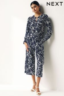 Navy Blue Swirl Print Long Sleeve Belted Jumpsuit (127551) | $78