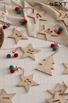 Set of 2 Red Wooden Star Alphabet Christmas Baubles (165449) | 3 €