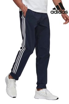 Spodnie dresowe Adidas Sportswear Aeroready Essentials 3-stripes ze zwężanymi nogawkami i elastycznymi mankietami (213389) | 120 zł