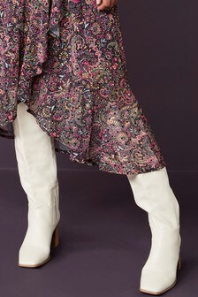 Cuissardes à talons évasés