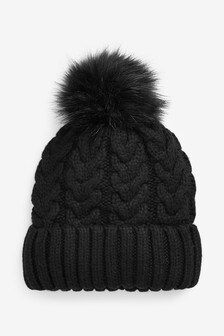 Bonnet à pompon en maille torsadée