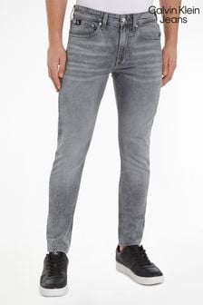 Szare jeansy Calvin Klein o dopasowanym kroju ze zwężanymi nogawkami (322466) | 347 zł