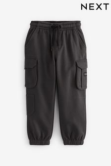 Czarny - Spodnie dresowe z detalami w stylu cargo (3-16 lat) (406718) | 73 zł - 94 zł
