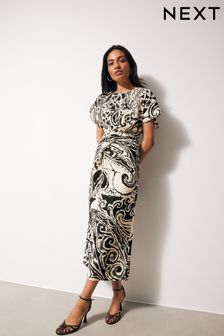 Biało-czarny paisley - Sukienka midi z krótkim rękawem i skręconą talią (410295) | 275 zł