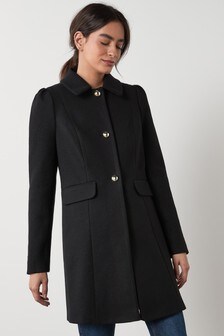 Manteau à épaules bouffantes