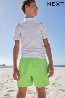 לבן - חולצת שחייה להגנה מפני השמש עם שרוולים קצרים (גילאי ‪1.5-16‬​​​​​​​) (456234) | ‏31 ₪ - ‏62 ₪